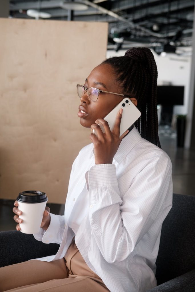 black businesswoman speaking on smartphone